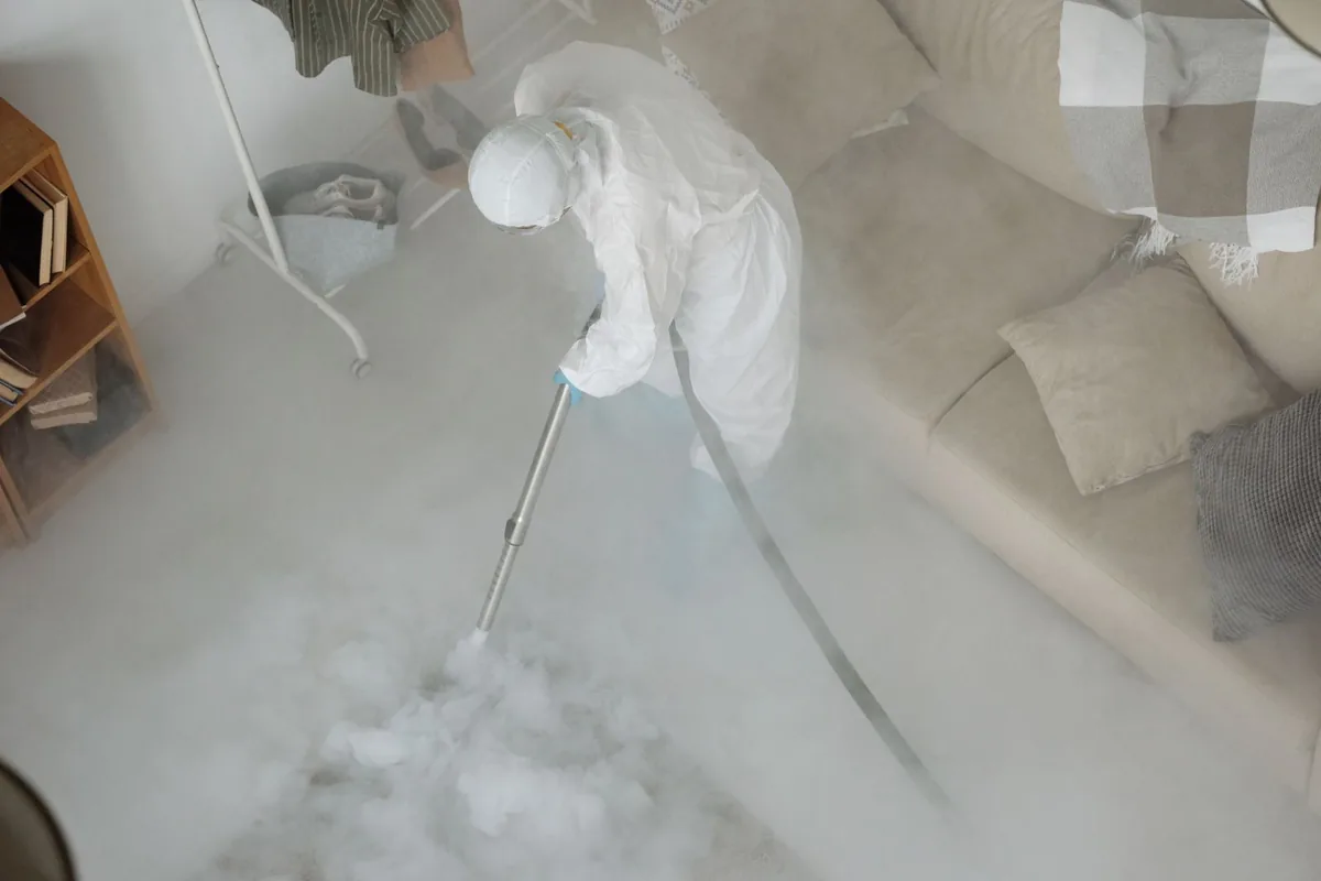 Biohazard cleanup technician in protective equipment, Panora, IA